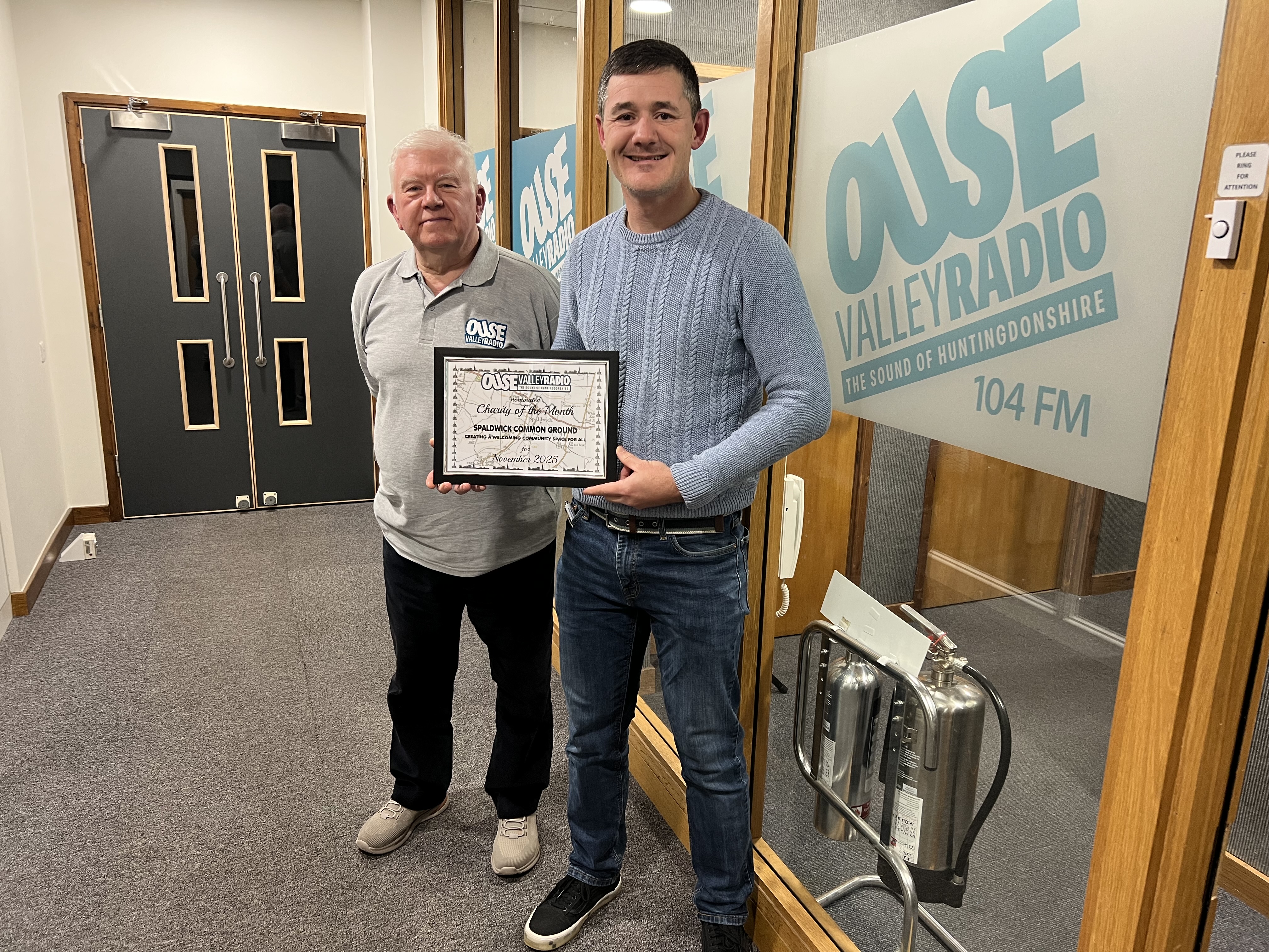 A picture of committee Spaldwick Common Ground committee member Johan Dreyer alongside Norman Knapper the host of Over to You at the Ouse Valley Radio Studios